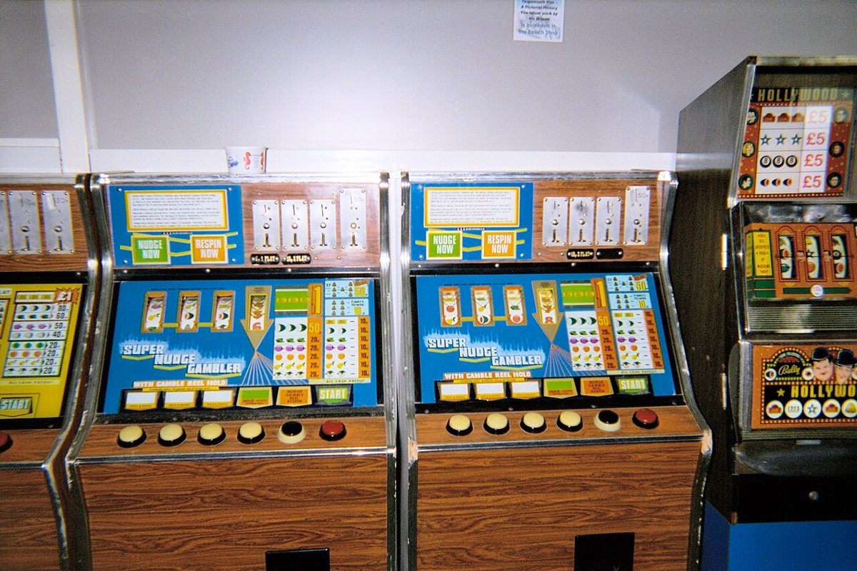 A row of gaming machines in a British seaside arcade